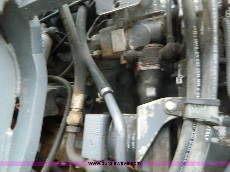 image for item H2306 2002 New Holland TL100 tractor