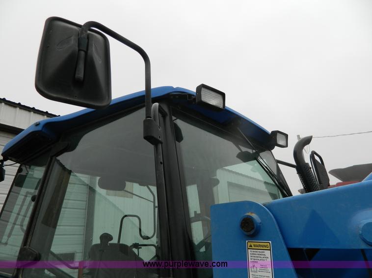 image for item H2306 2002 New Holland TL100 tractor