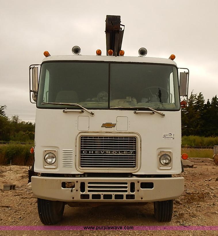 image for item J3092 1975 Chevrolet flatbed truck with crane