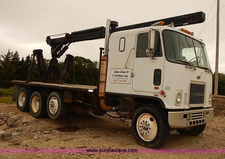 image for item J3092 1975 Chevrolet flatbed truck with crane