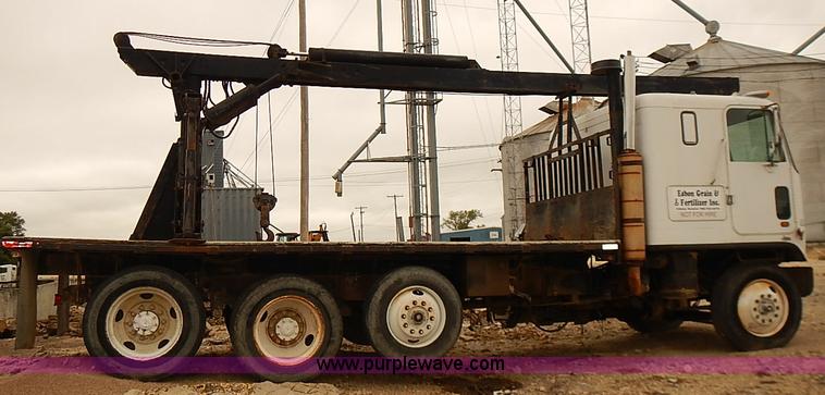 image for item J3092 1975 Chevrolet flatbed truck with crane