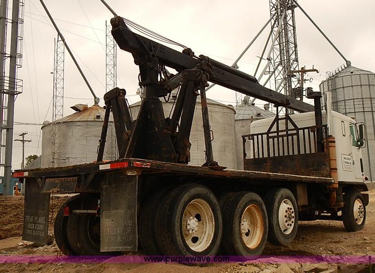 image for item J3092 1975 Chevrolet flatbed truck with crane