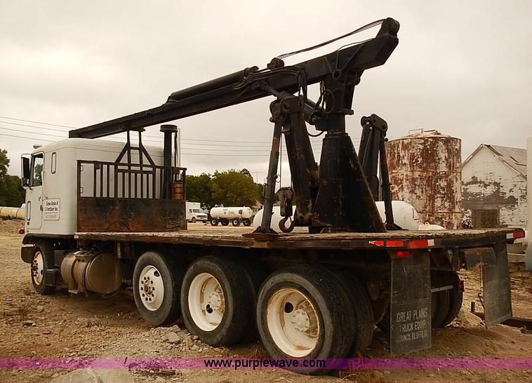 image for item J3092 1975 Chevrolet flatbed truck with crane