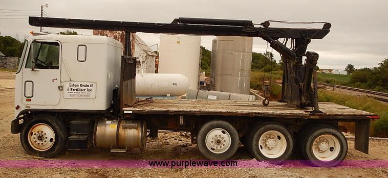 image for item J3092 1975 Chevrolet flatbed truck with crane