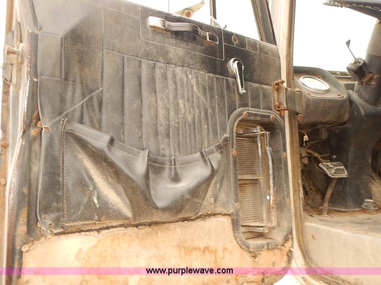 image for item J3092 1975 Chevrolet flatbed truck with crane