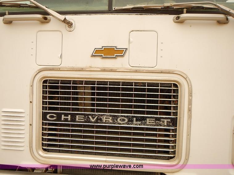 image for item J3092 1975 Chevrolet flatbed truck with crane