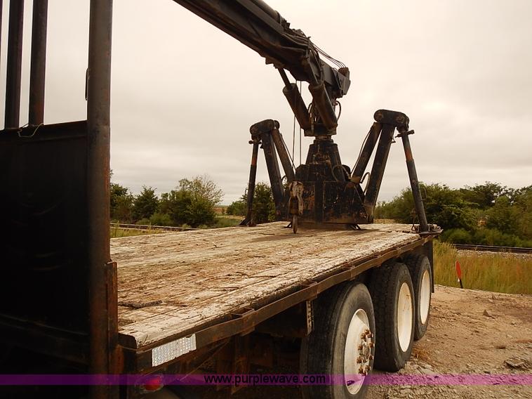 image for item J3092 1975 Chevrolet flatbed truck with crane