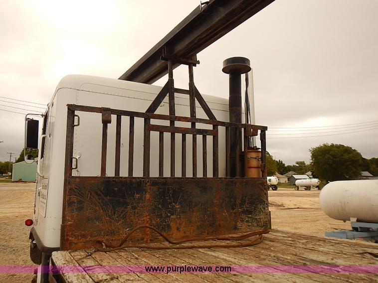 image for item J3092 1975 Chevrolet flatbed truck with crane