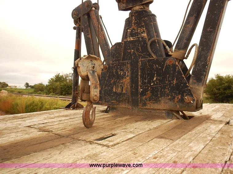 image for item J3092 1975 Chevrolet flatbed truck with crane