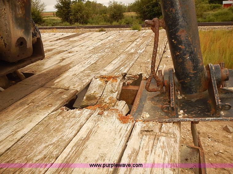 image for item J3092 1975 Chevrolet flatbed truck with crane