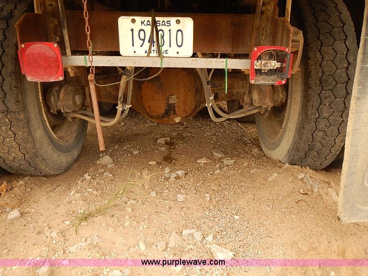 image for item J3092 1975 Chevrolet flatbed truck with crane