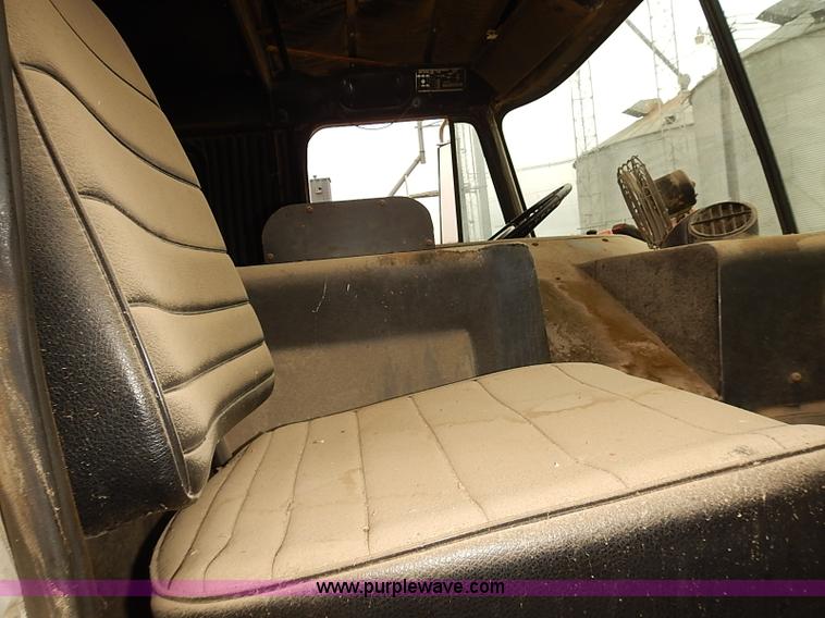 image for item J3092 1975 Chevrolet flatbed truck with crane