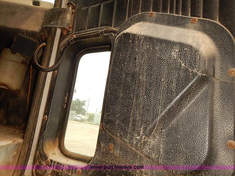 image for item J3092 1975 Chevrolet flatbed truck with crane