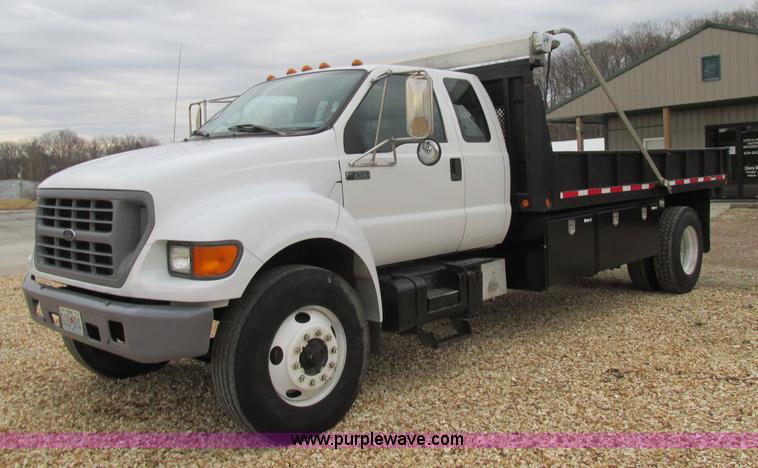 image for item H7687 2000 Ford F750 Super Duty XL Ext. Cab flatbed dump truck
