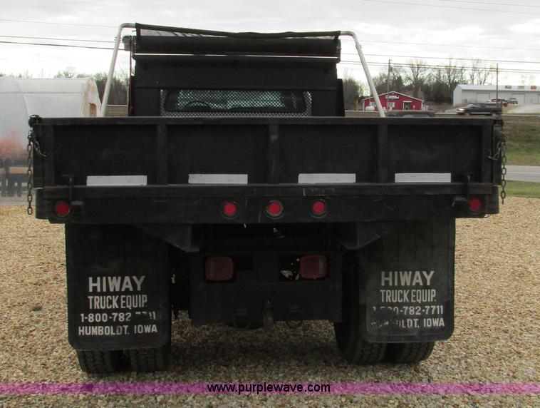 image for item H7687 2000 Ford F750 Super Duty XL Ext. Cab flatbed dump truck
