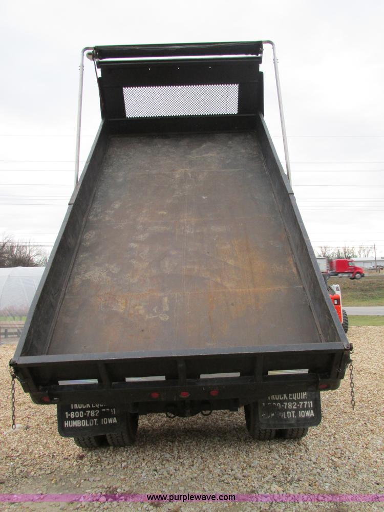 image for item H7687 2000 Ford F750 Super Duty XL Ext. Cab flatbed dump truck