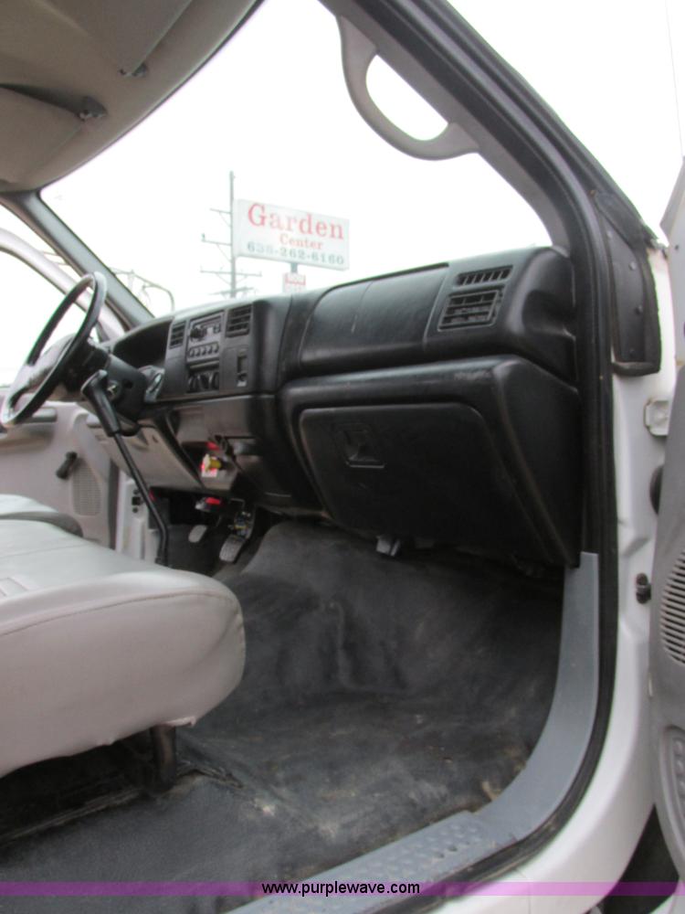 image for item H7687 2000 Ford F750 Super Duty XL Ext. Cab flatbed dump truck