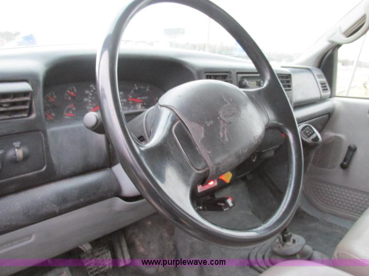 image for item H7687 2000 Ford F750 Super Duty XL Ext. Cab flatbed dump truck