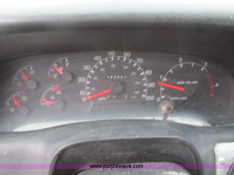 image for item H7687 2000 Ford F750 Super Duty XL Ext. Cab flatbed dump truck