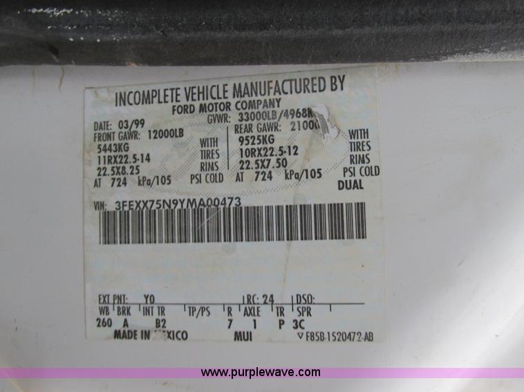 image for item H7687 2000 Ford F750 Super Duty XL Ext. Cab flatbed dump truck