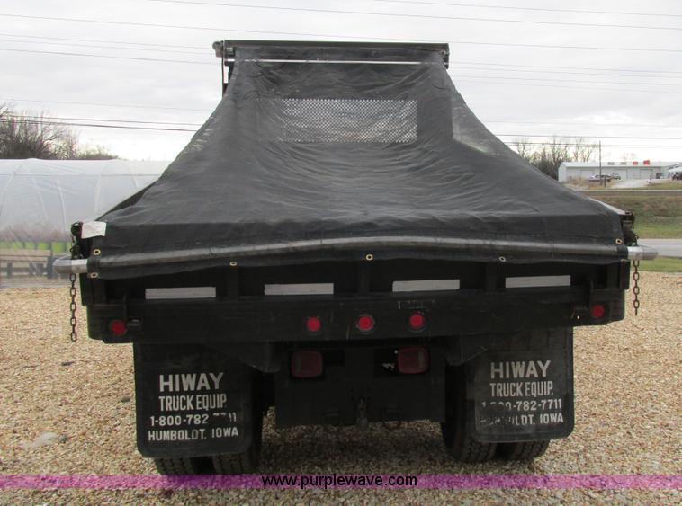 image for item H7687 2000 Ford F750 Super Duty XL Ext. Cab flatbed dump truck