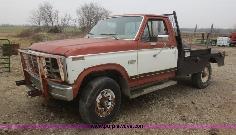 image for item D2234 1984 Ford F250 flatbed pickup truck