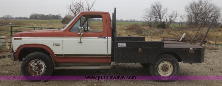 image for item D2234 1984 Ford F250 flatbed pickup truck