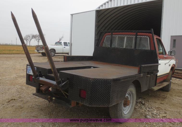 image for item D2234 1984 Ford F250 flatbed pickup truck