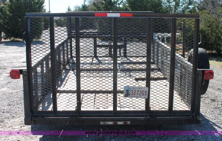 image for item H5517 2010 Trailmaster tandem axle flatbed utility trailer