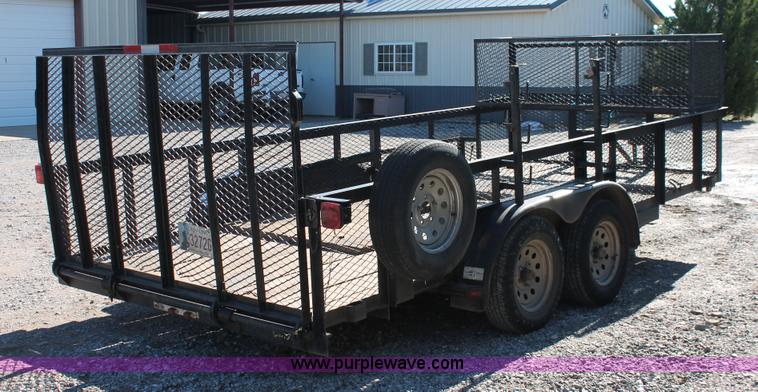 image for item H5517 2010 Trailmaster tandem axle flatbed utility trailer