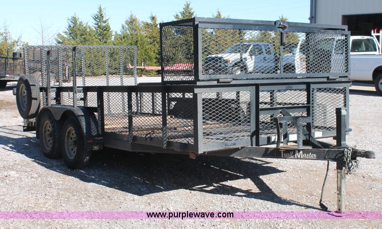 image for item H5517 2010 Trailmaster tandem axle flatbed utility trailer