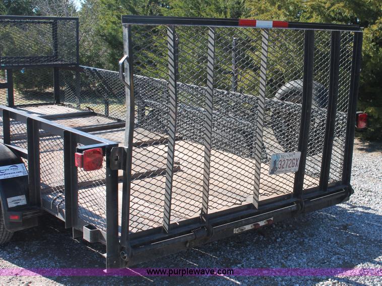 image for item H5517 2010 Trailmaster tandem axle flatbed utility trailer