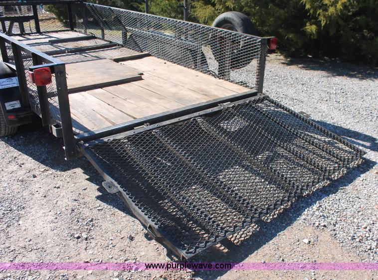 image for item H5517 2010 Trailmaster tandem axle flatbed utility trailer