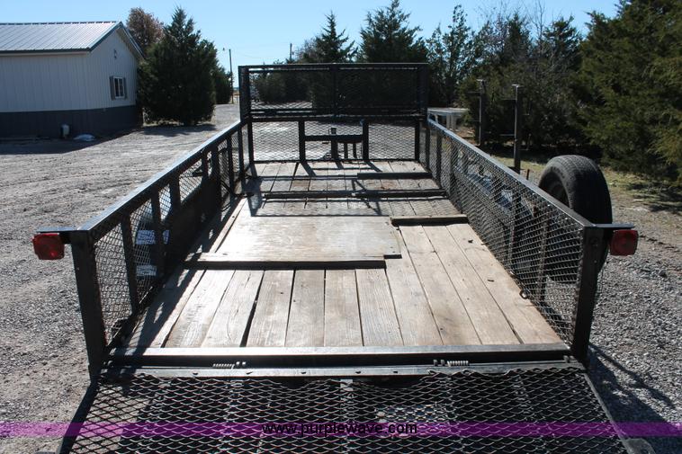 image for item H5517 2010 Trailmaster tandem axle flatbed utility trailer