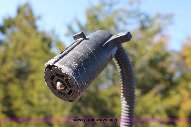 image for item H5517 2010 Trailmaster tandem axle flatbed utility trailer