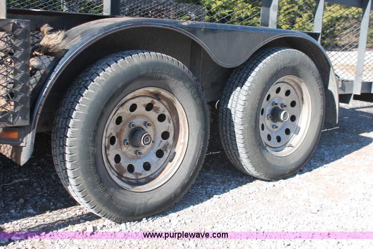 image for item H5517 2010 Trailmaster tandem axle flatbed utility trailer