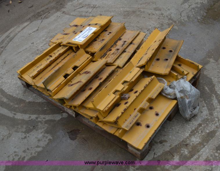 image for item I6944 Approximately 37 Caterpillar D4HXL track pads