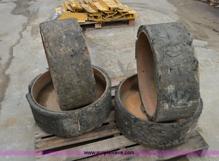 image for item I6945 Eight lug skid steer solid wheels and tires