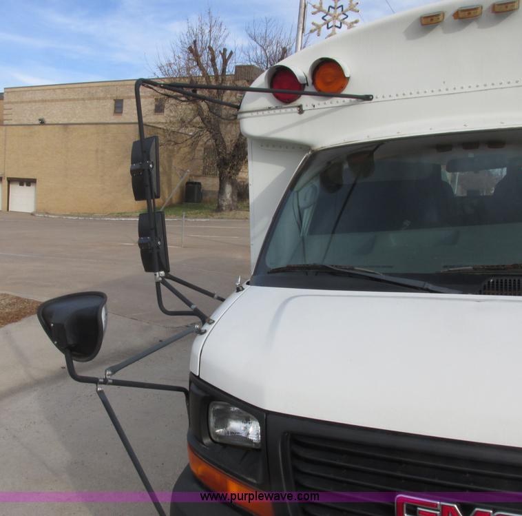 image for item J2357 2004 GMC Savana Thomas Built bus