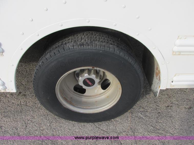 image for item J2358 2004 GMC Savana Thomas Built bus