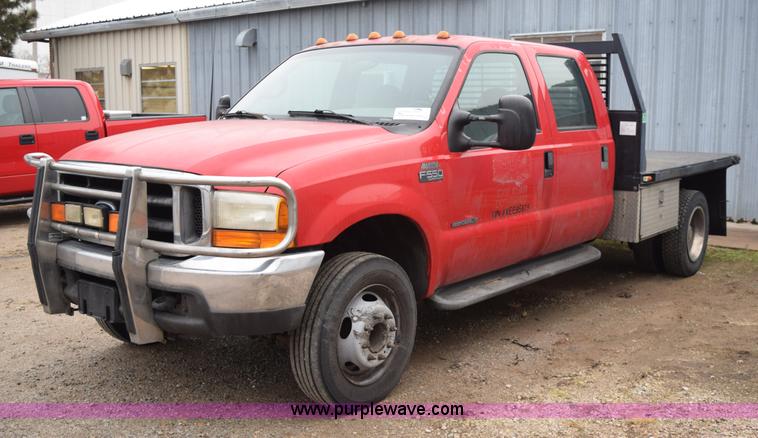 image for item I8591 1999 Ford F550 Super Duty XLT Crew Cab flatbed truck