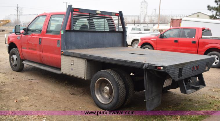 image for item I8591 1999 Ford F550 Super Duty XLT Crew Cab flatbed truck