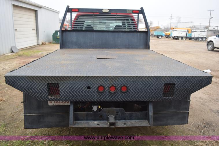 image for item I8591 1999 Ford F550 Super Duty XLT Crew Cab flatbed truck