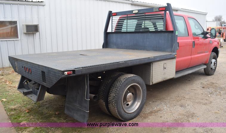 image for item I8591 1999 Ford F550 Super Duty XLT Crew Cab flatbed truck