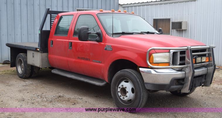 image for item I8591 1999 Ford F550 Super Duty XLT Crew Cab flatbed truck