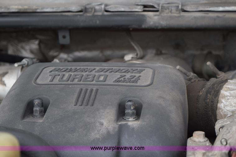 image for item I8591 1999 Ford F550 Super Duty XLT Crew Cab flatbed truck