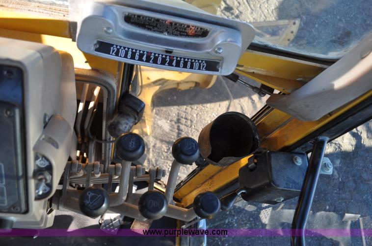 image for item F2174 1999 John Deere 772CH articulated motor grader