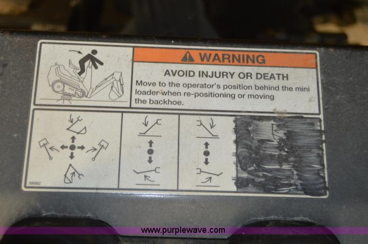 image for item Z9273 Bobcat M06 skid steer backhoe attachment