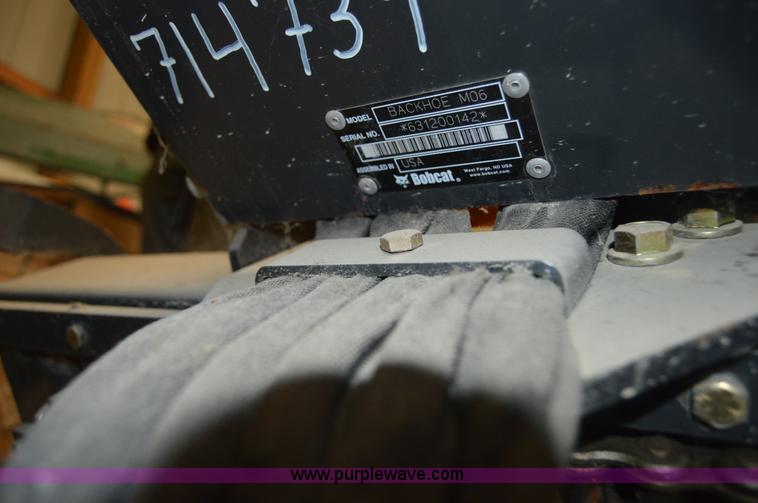 image for item Z9273 Bobcat M06 skid steer backhoe attachment