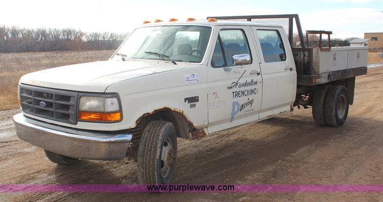image for item I2463 1995 Ford F350 XL Crew Cab flatbed pickup truck